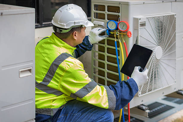Professional Heat Pump Repair technician working in Honeyville, UT